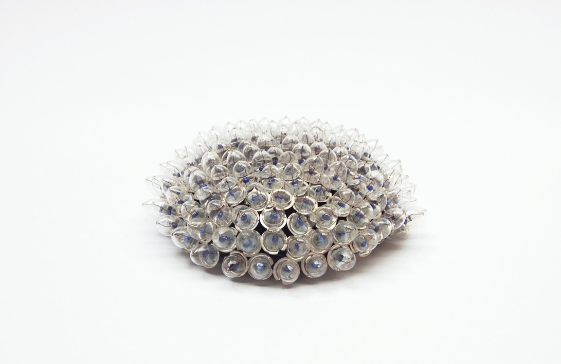 Creature #,  lightbulbs, ceramic, and silicone adhesive, 6" diameter 3" height